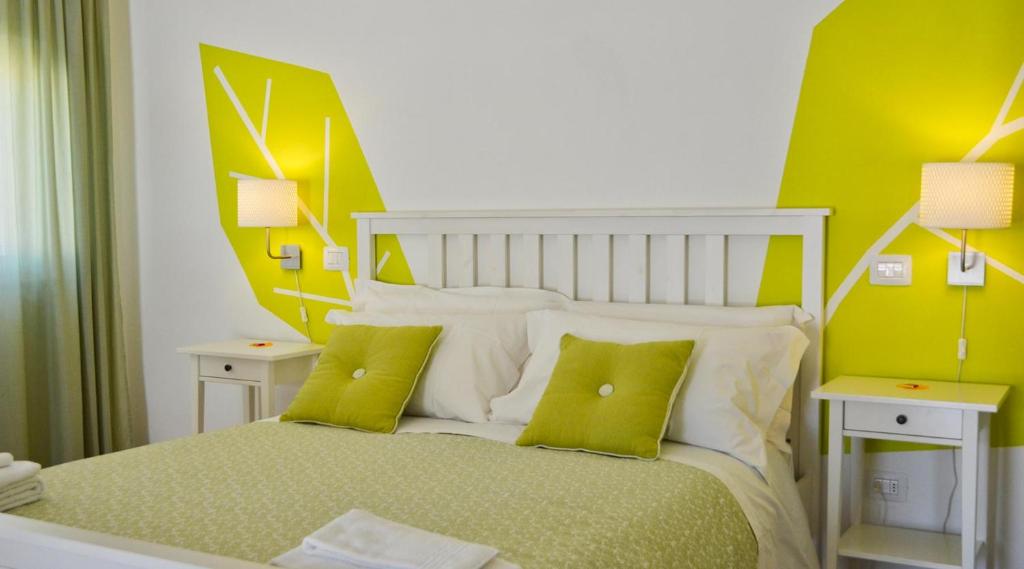 Postel nebo postele na pokoji v ubytování Petit Hotel