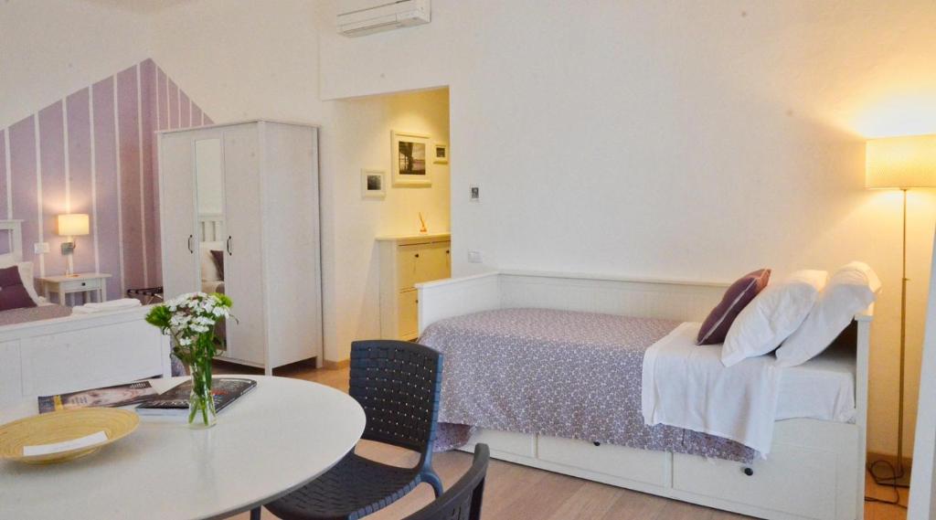 Postel nebo postele na pokoji v ubytování Petit Hotel