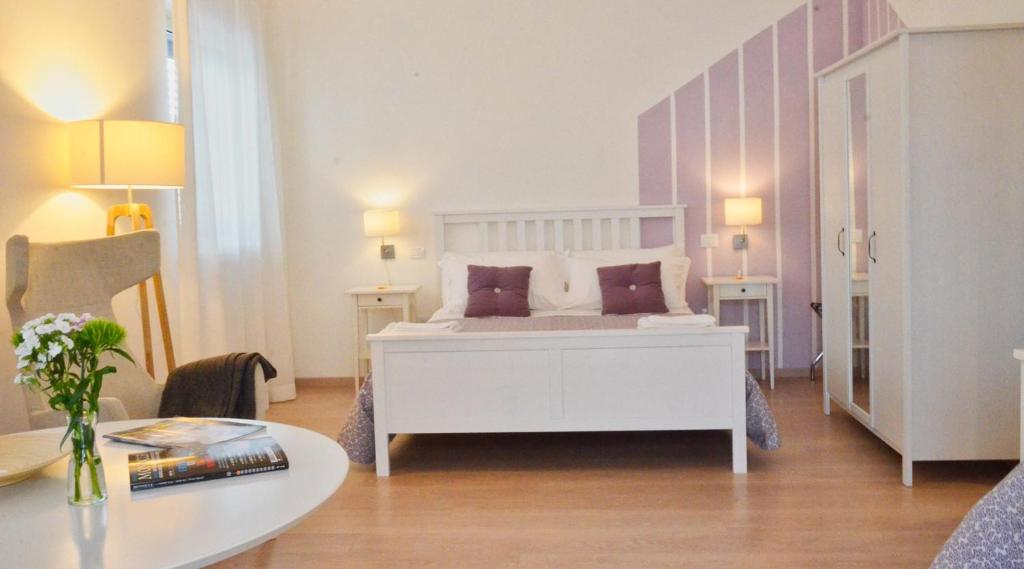 Postel nebo postele na pokoji v ubytování Petit Hotel