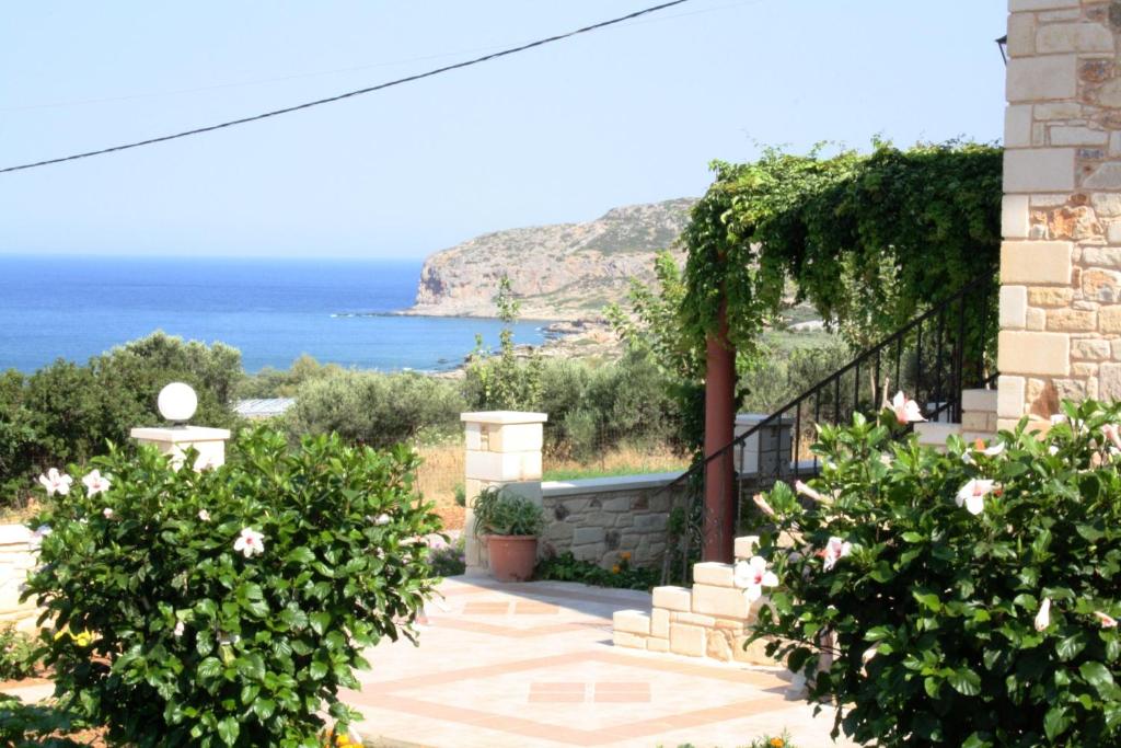 a house with a view of the ocean at Romantica Apartments in Falasarna