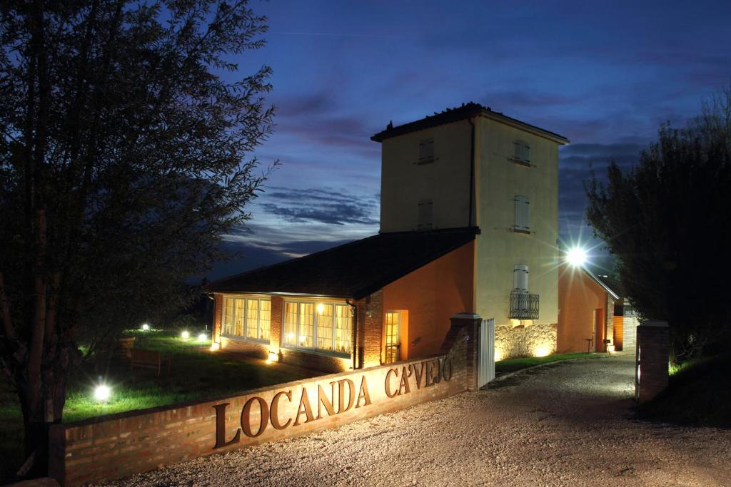 a building with a sign in front of it at night at Locanda Ca'Vejo srl in Megliadino San Vitale
