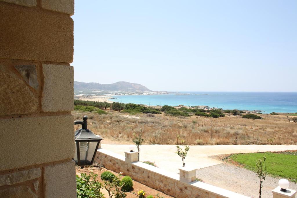 a view of the ocean from a wall at Romantica Apartments in Falasarna