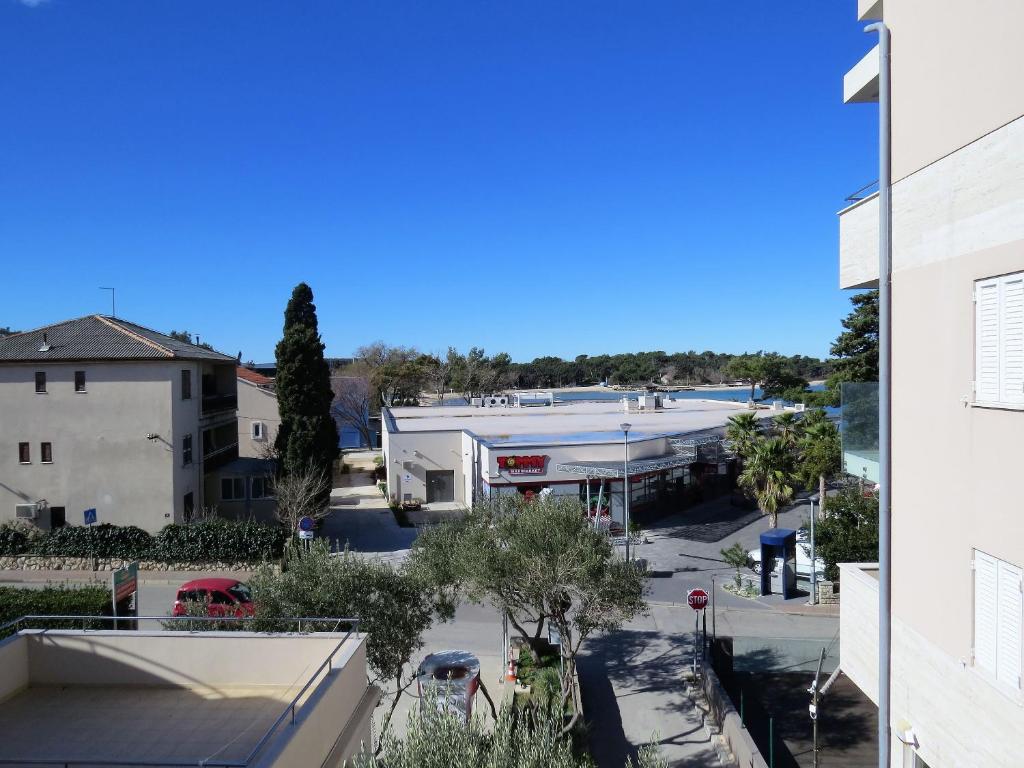 a view of a parking lot from a building at Apartments Karolina in Novalja