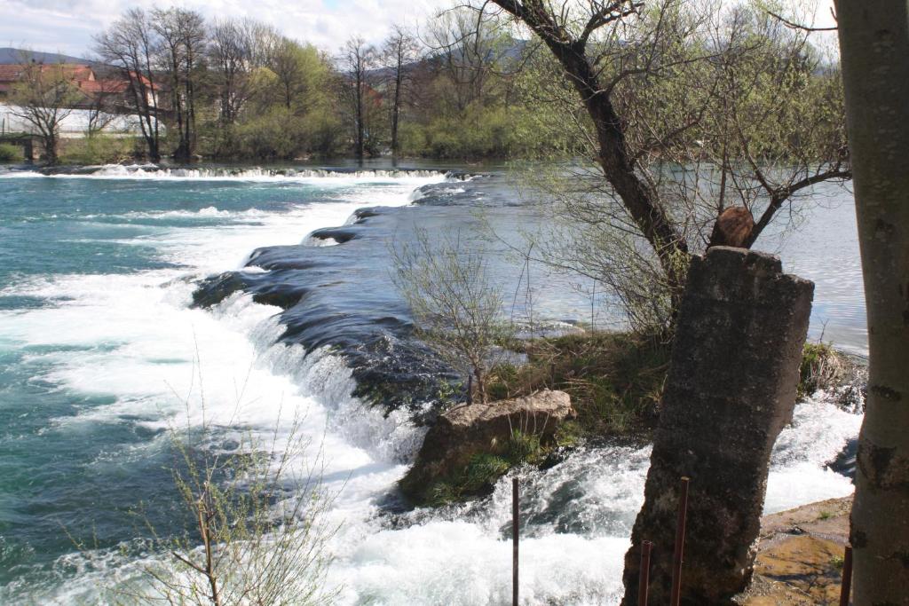 a river with rapids on top of it at LGP Exclusive Apartment in Bihać