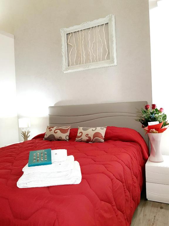 Łóżko lub łóżka w pokoju w obiekcie B&B Casa di Anita