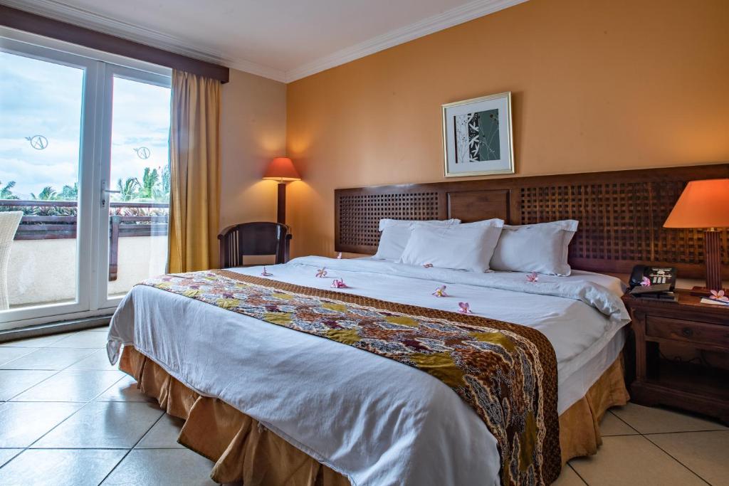 Postel nebo postele na pokoji v ubytování Aanari Hotel & Spa- Mauritius