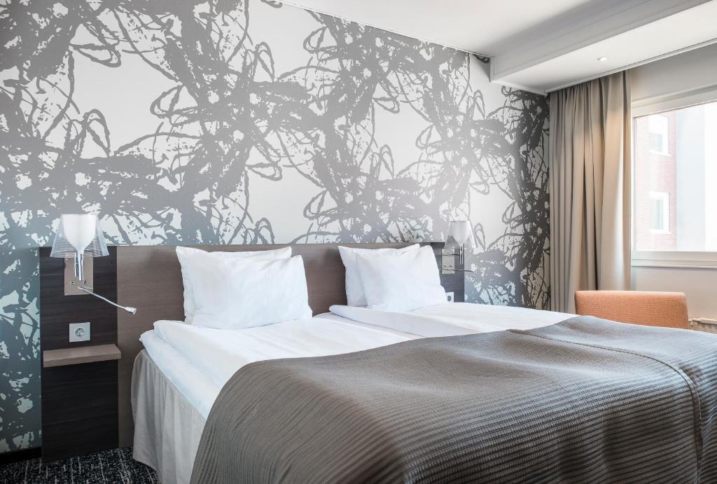 Postel nebo postele na pokoji v ubytování Quality Hotel Luleå