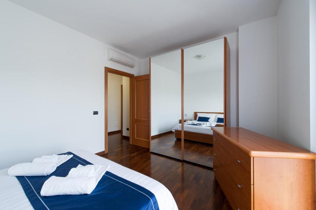 Łóżko lub łóżka w pokoju w obiekcie Domus al Parco Guest House