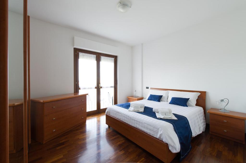 Łóżko lub łóżka w pokoju w obiekcie Domus al Parco Guest House