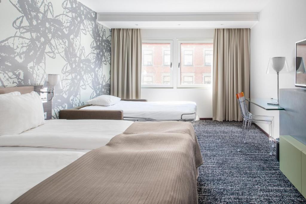 Postel nebo postele na pokoji v ubytování Quality Hotel Luleå