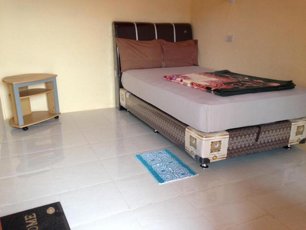 Postel nebo postele na pokoji v ubytování Aman's Guesthouse