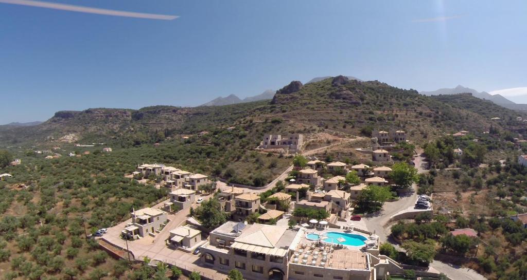 an aerial view of a resort with a mountain at Kolokotronis Hotel & Spa in Stoupa