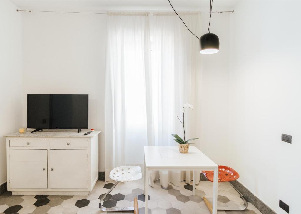 Televízia a/alebo spoločenská miestnosť v ubytovaní La Concha Suites