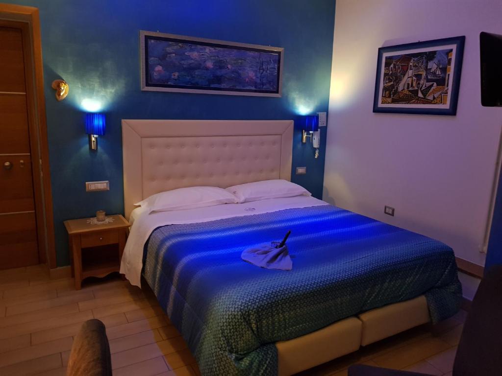 Postel nebo postele na pokoji v ubytování b&b Dea Fortuna