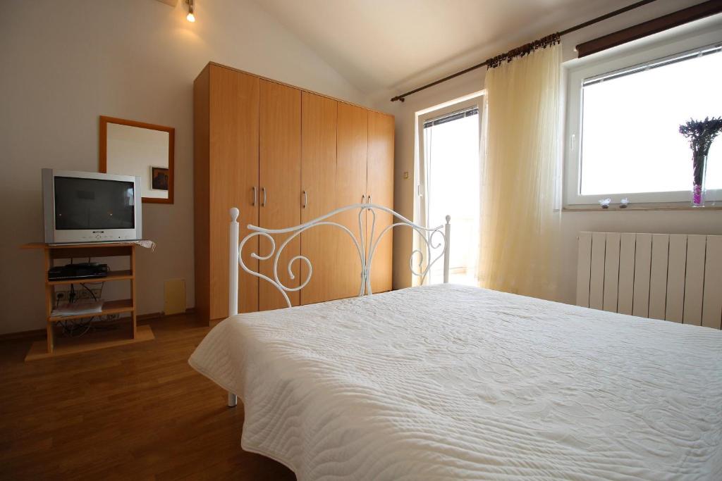 Posteľ alebo postele v izbe v ubytovaní Apartments IVONA 6