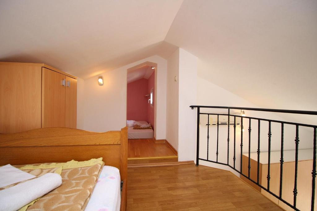 Posteľ alebo postele v izbe v ubytovaní Apartments IVONA 6