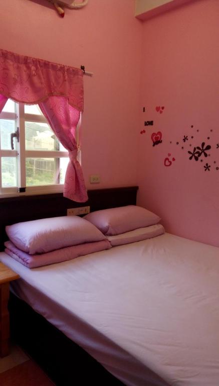 Postel nebo postele na pokoji v ubytování Fu Ya N B&B