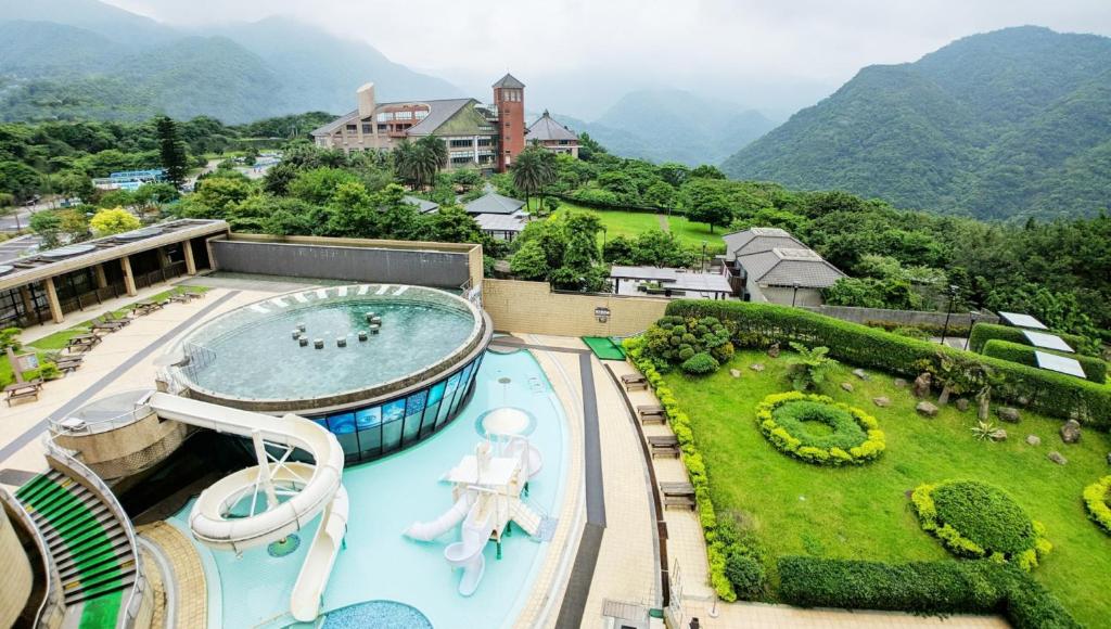a view of a resort with a swimming pool at Yang Ming Shan Tien Lai Resort &amp; Spa in Jinshan
