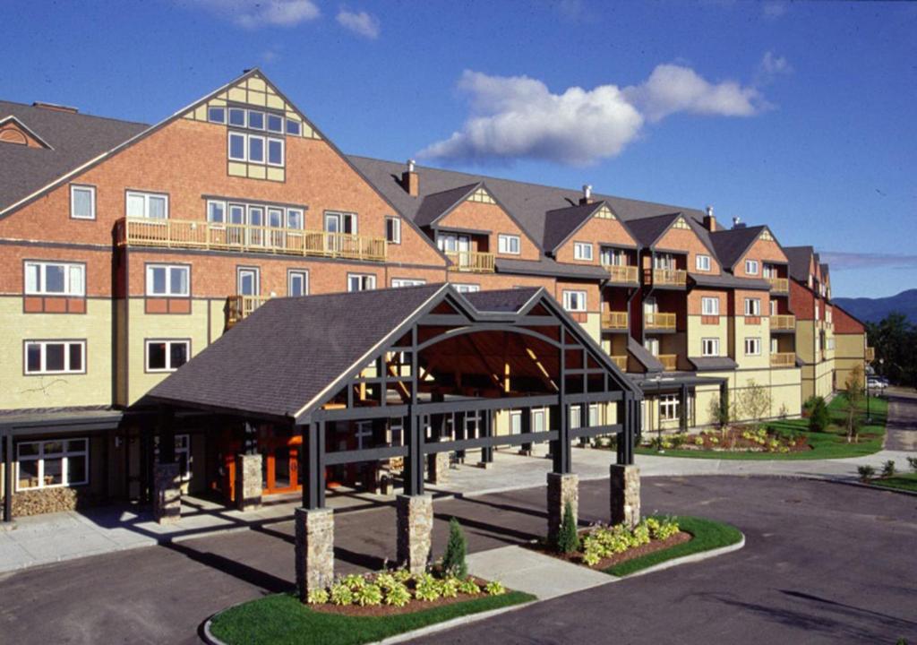 a large building with a parking lot in front of it at Jordan Hotel in Newry