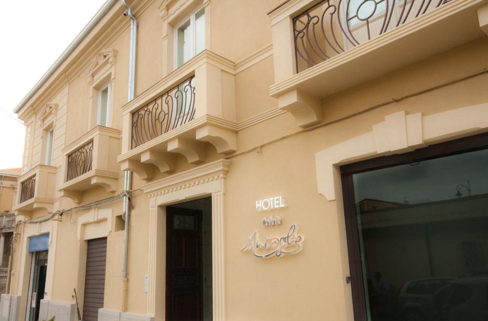 a building with a hotel sign on the side of it at Hotel Muraglie in Vibo Valentia