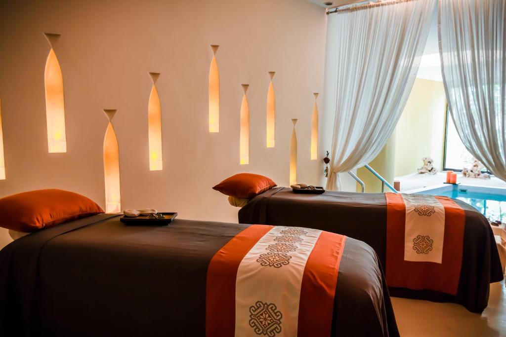 Postel nebo postele na pokoji v ubytování Grand Velas Riviera Maya - All Inclusive