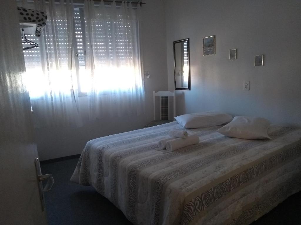 Posteľ alebo postele v izbe v ubytovaní Pousada Dona Luiza