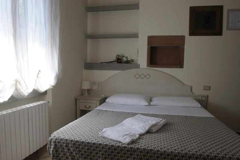 Posteľ alebo postele v izbe v ubytovaní La Spiga Affittacamere