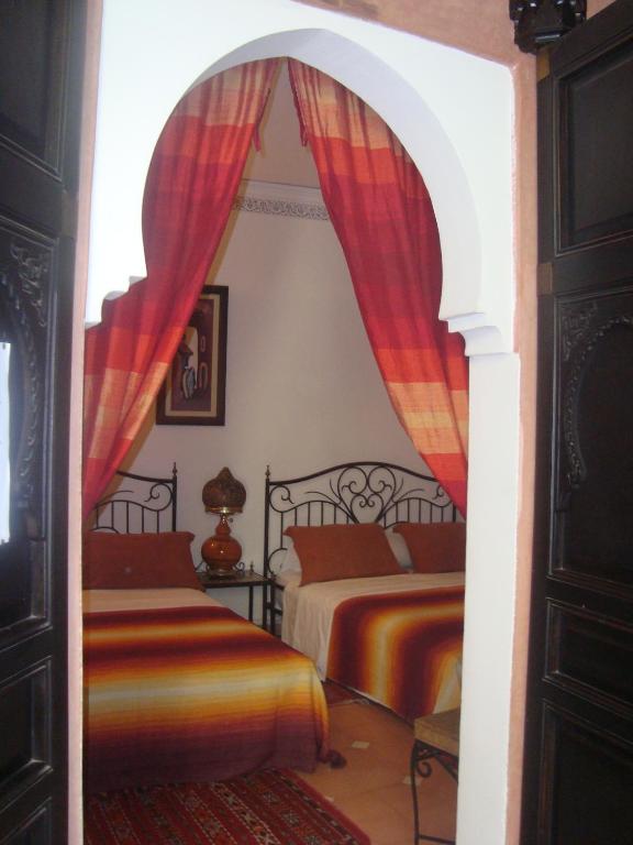 Letto o letti in una camera di Riad Jnane Mogador