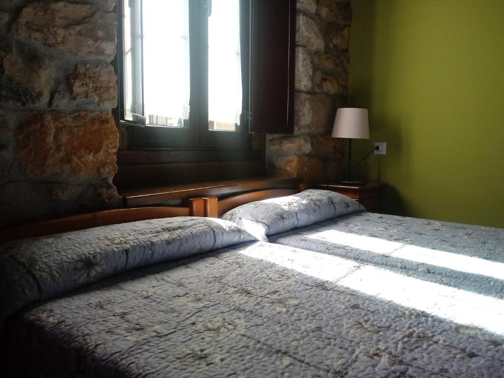 Postel nebo postele na pokoji v ubytování Hotel Rural Posada Del Monasterio