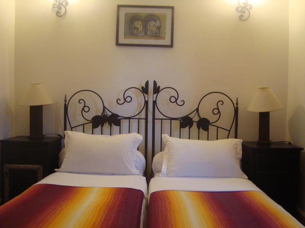 Letto o letti in una camera di Riad Jnane Mogador