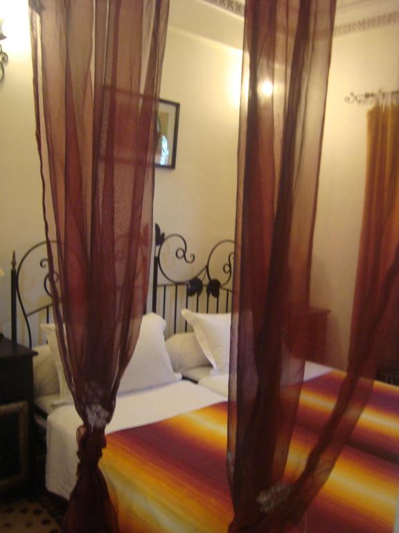 Letto o letti in una camera di Riad Jnane Mogador