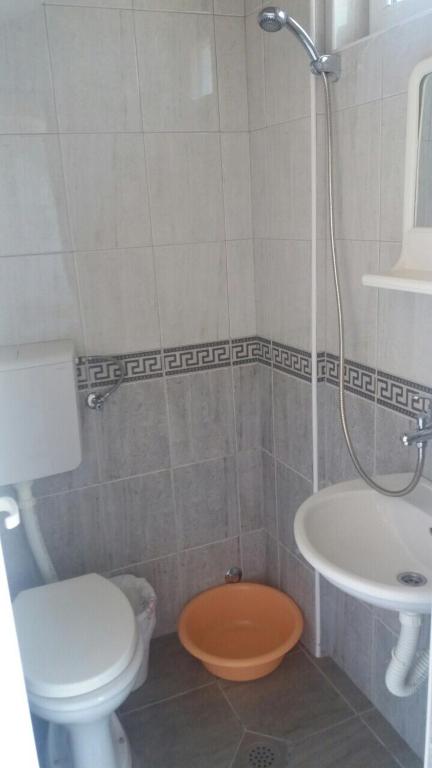 a bathroom with a toilet and a sink at Guesthouse Stankovic in Sutomore