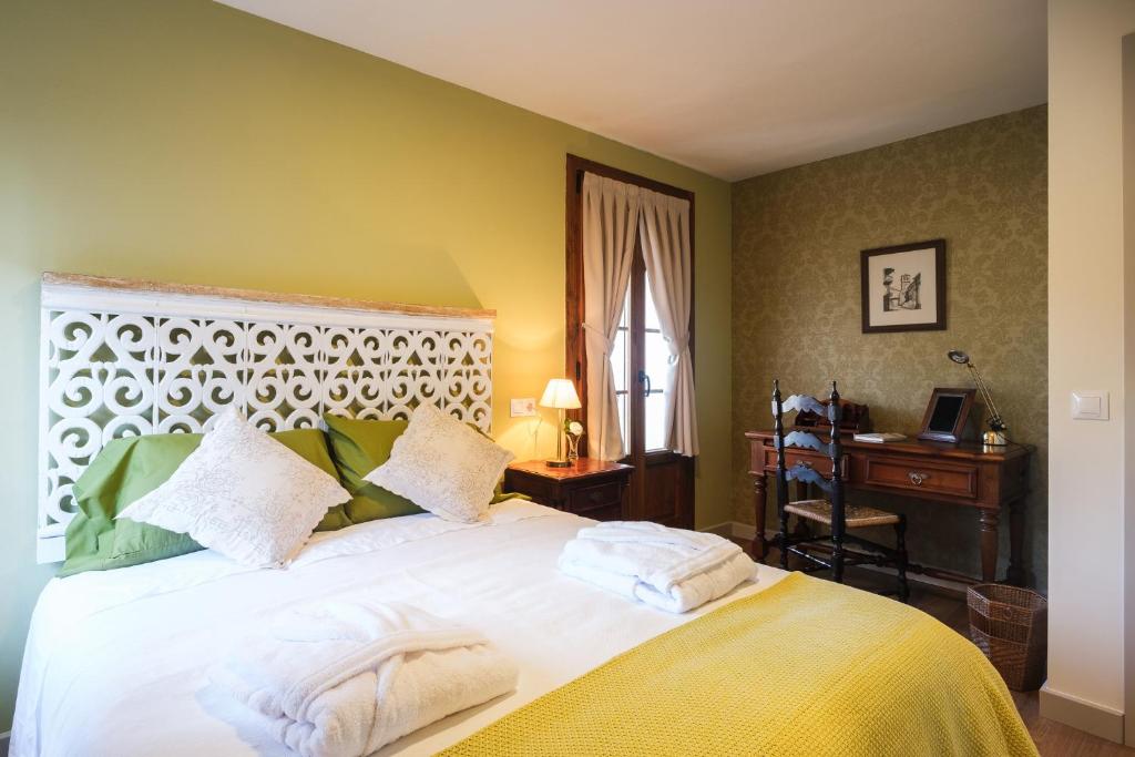 Ένα ή περισσότερα κρεβάτια σε δωμάτιο στο Torre del Marqués