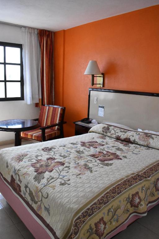 Postel nebo postele na pokoji v ubytování Hotel Baluarte