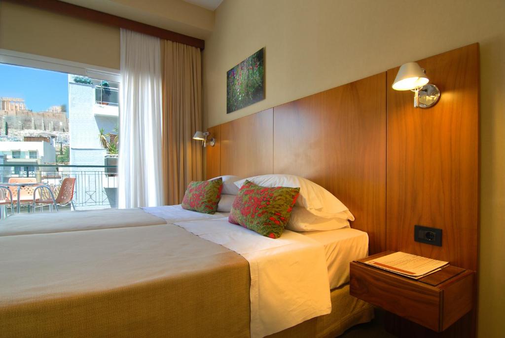 Postel nebo postele na pokoji v ubytování Philippos Hotel