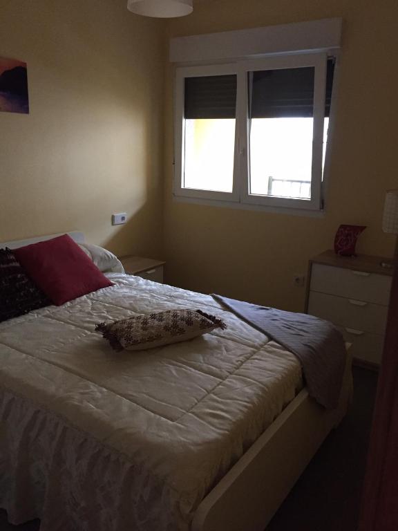 A bed or beds in a room at Playa Altar Vistas a la Ría