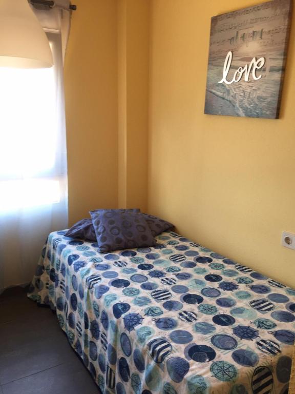 A bed or beds in a room at Playa Altar Vistas a la Ría