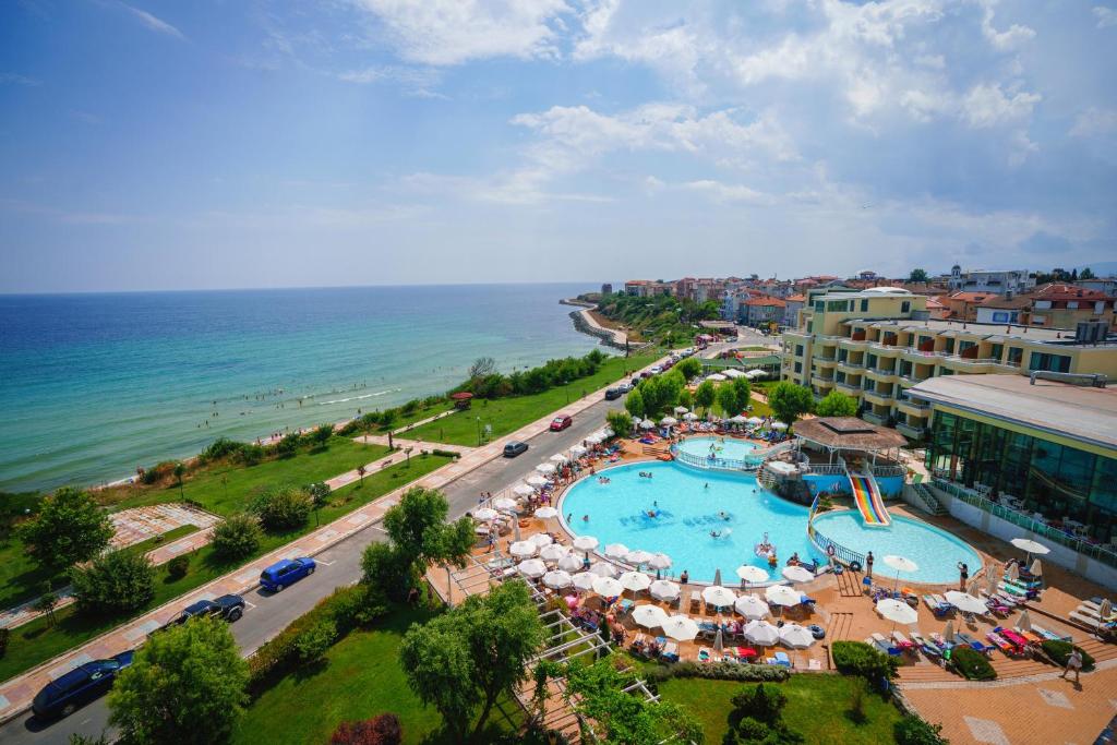 an aerial view of a resort with a swimming pool and the ocean at Hotel Perla Beach Luxury - All Inclusive & Free Beach Access in Primorsko