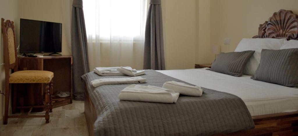 Postel nebo postele na pokoji v ubytování Hotel "VIR"
