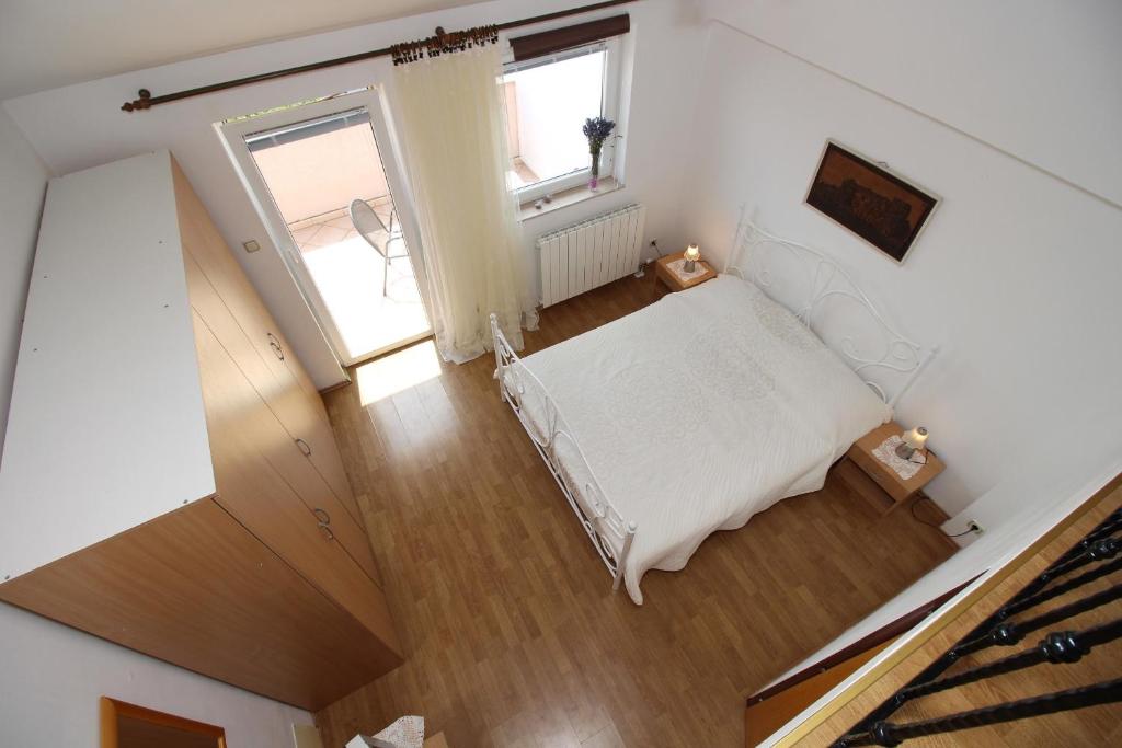Posteľ alebo postele v izbe v ubytovaní Apartments IVONA 6