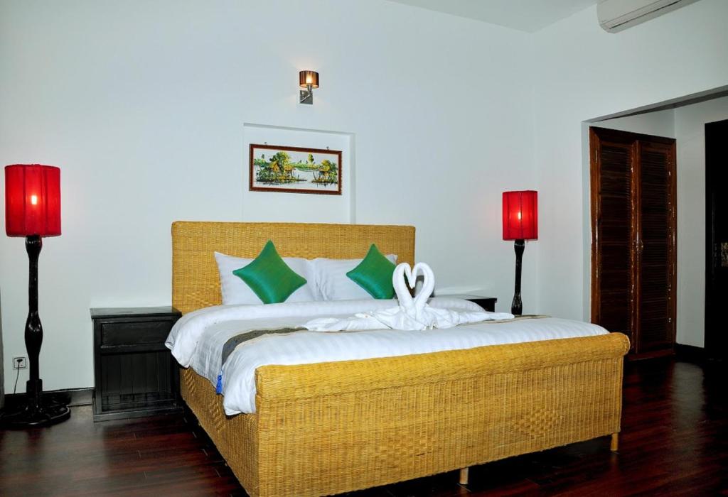 Postel nebo postele na pokoji v ubytování Vimean Sovannaphoum Resort