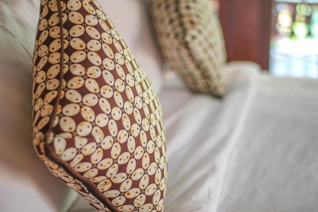 Postel nebo postele na pokoji v ubytování Ari Cottages Ubud