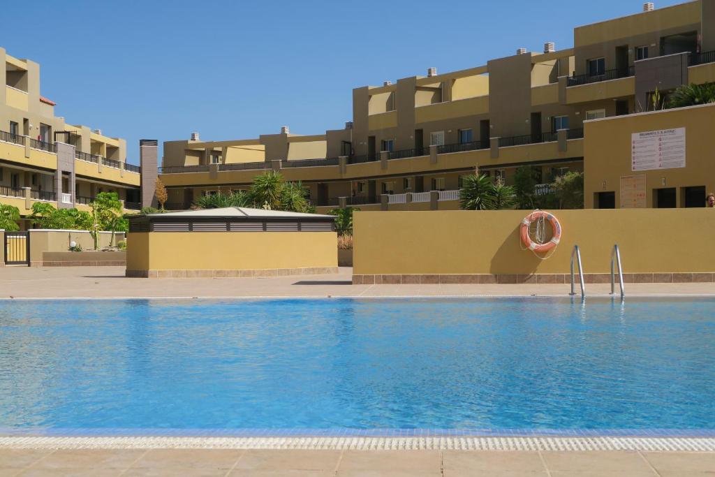 Bazén v ubytování MEDANO4YOU Pearl Flavour Holiday Home nebo v jeho okolí