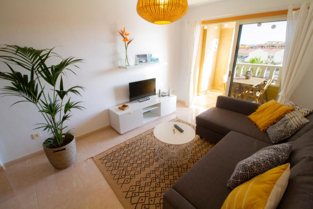 Posezení v ubytování MEDANO4YOU Pearl Flavour Holiday Home