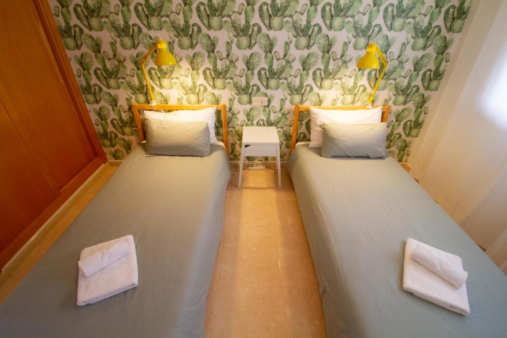Postel nebo postele na pokoji v ubytování MEDANO4YOU Pearl Flavour Holiday Home
