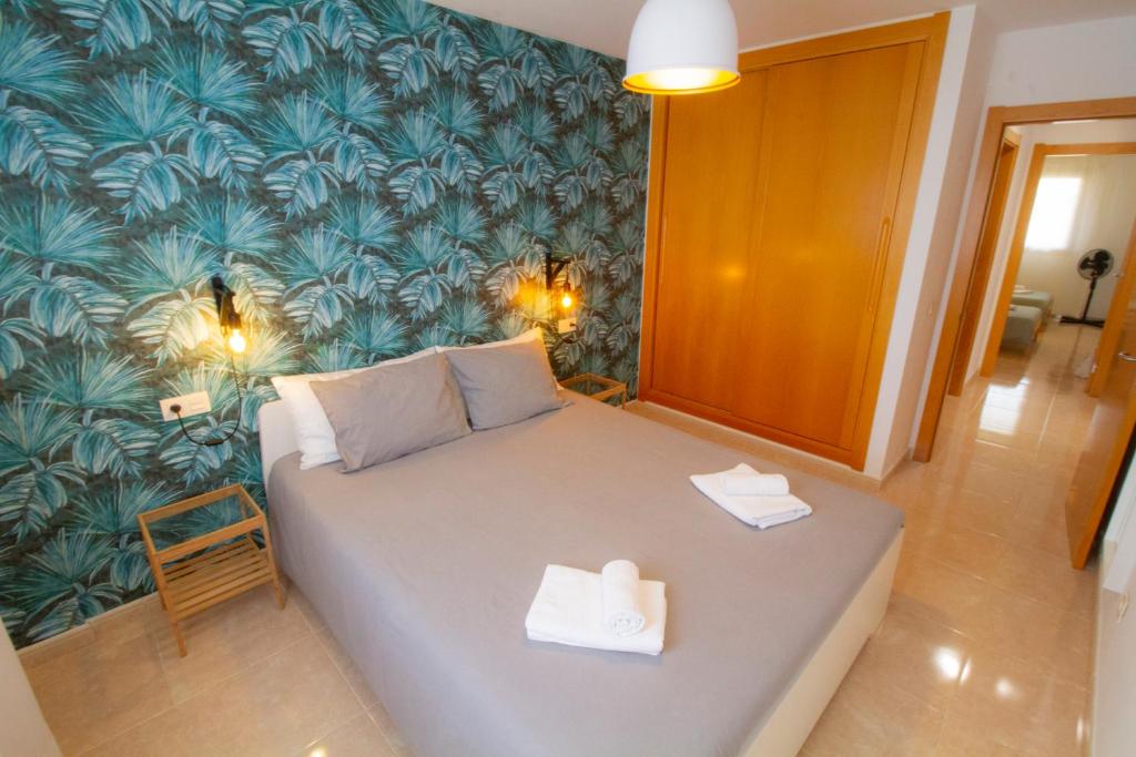 Postel nebo postele na pokoji v ubytování MEDANO4YOU Pearl Flavour Holiday Home
