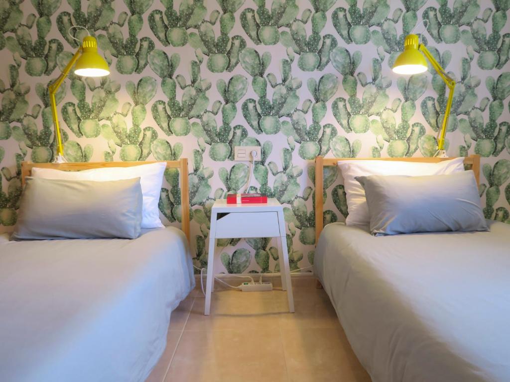 Postel nebo postele na pokoji v ubytování MEDANO4YOU Pearl Flavour Holiday Home