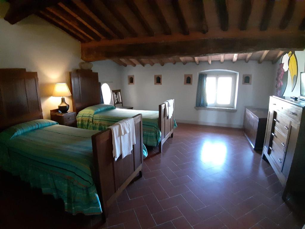 Postel nebo postele na pokoji v ubytování B&B Glicine e Luna