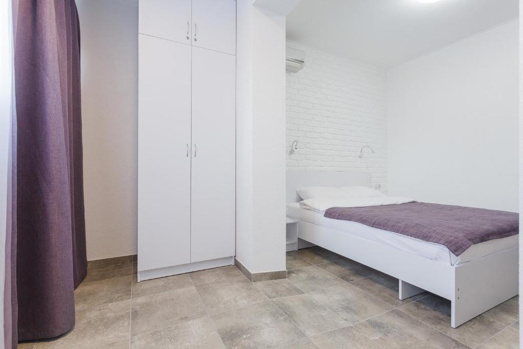 Postel nebo postele na pokoji v ubytování SkyHome na Nauky