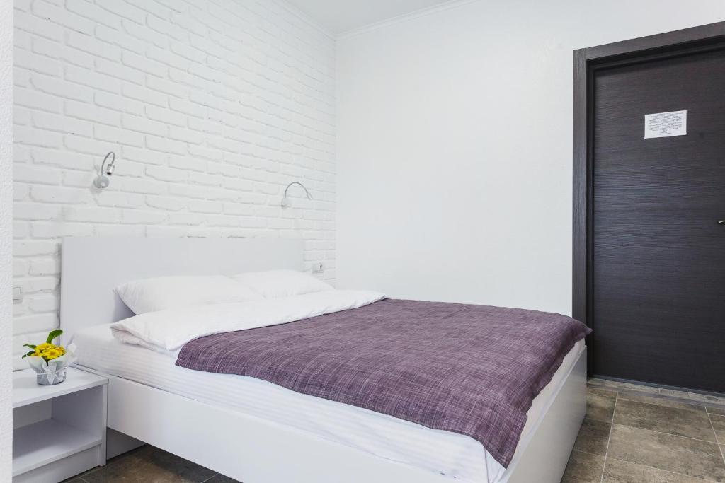 Postel nebo postele na pokoji v ubytování SkyHome na Nauky